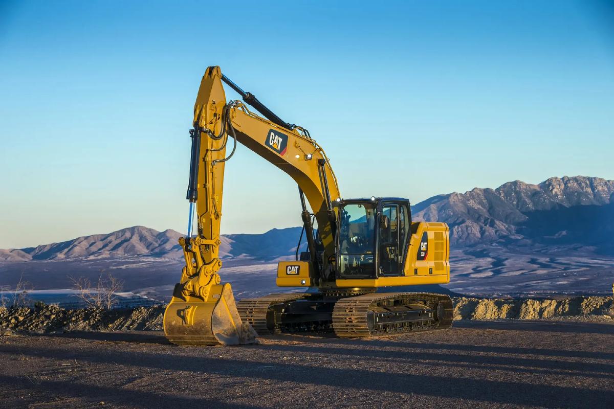 Yellow excavator heavy construction machinery at work on job site